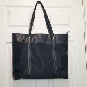 Targus tote bag TSA friendly. Laptop bag, Black with leather and nylon. Interior